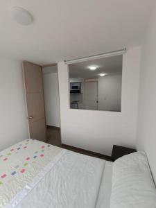 Postel nebo postele na pokoji v ubytování Apartamentos Cardio - Usaquén