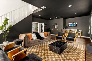 a living room with a couch and a table at Spacious Retreat with Pool & Hot Tub - 10 Minutes to Downtown in San Antonio