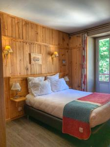 Postel nebo postele na pokoji v ubytování Hôtel Quin Te Va