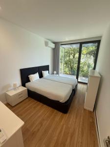 Ένα ή περισσότερα κρεβάτια σε δωμάτιο στο Casa das Teixugueiras