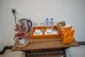 Příslušenství pro přípravu čaje a kávy v ubytování The Cozy Nest - Sigiriya + 17 fotografií