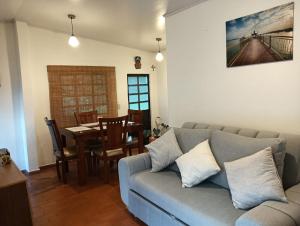 a living room with a couch and a dining room at Villa Alegría in Choachí