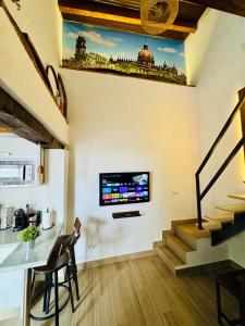 TV a/nebo společenská místnost v ubytování Apartamento con Entreplanta Alegría de Jerez