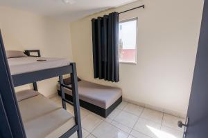 Voodi või voodid majutusasutuse Prático Assis - Arena MRV - Com Garagem toas