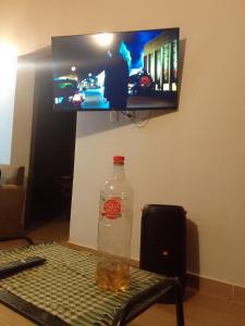 TV a/nebo společenská místnost v ubytování Escondidos