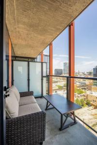 a living room with a couch and a table at Bright & Modern 2BR Perfect City Escape in Chicago