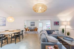 a living room with a couch and a table at Coastal Getaway minutes from Siesta Key Beach in Sarasota