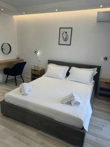Ένα ή περισσότερα κρεβάτια σε δωμάτιο στο Sunset Horizon Apartments