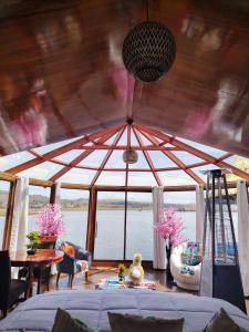 a living room with a large glass ceiling at Sky Domo Titicaca Lodge in Puno