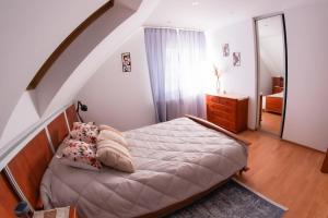 a bedroom with a bed and a stair case at Dom w Chomranicach- Jacuzzi, domek grillowy in Chomranice +62 photos