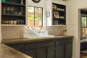 a kitchen with a sink and a window at Clinton Street House: Your Lafayette Home Base in Lafayette