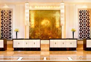 a lobby with a large painting on the wall at Trump Hotel Las Vegas Studio Strip Views in Las Vegas