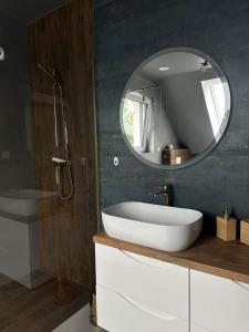 a bathroom with a white sink and a mirror at Willa Daisy in Jaskulin +41 photos