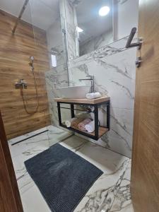 a bathroom with a sink and a mirror at Vacation home Vilim in Kamešnica +8 photos