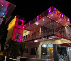 a building with christmas lights on it at Beach Residency in Kāsarkod