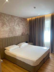 Ένα ή περισσότερα κρεβάτια σε δωμάτιο στο Hotel Piemonte