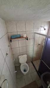a small bathroom with a toilet and a shower at Pousada São Paulo - Quartos com WC Exclusivo in Recife