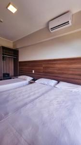 Un ou plusieurs lits dans un hébergement de l'établissement Apartamento Barretos Country Resort