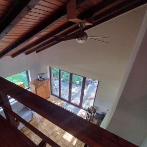 an overhead view of a living room with a ceiling fan at Villa Aroleid in Port-Valais +2 photos