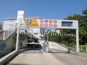 a gas station with a parking sign on a street at cà venice tour vaction in Mestre