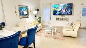 a living room with a couch and a table at Christmas 3BR , King and Queen Beds , Uptown Charlotte in Charlotte