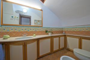 a bathroom with a sink and a mirror at Casa Ermelinda in Amalfi +28 photos