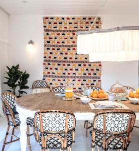 a dining room with a wooden table and chairs at Quinta de Sá in Vila Nova de Gaia +30 photos