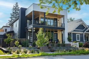 a large house with a balcony at Downtown Luxury Villa Hot Tub Walk To Lake in Coeur d'Alene