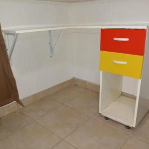a desk with two drawers and a colorful cabinet at Casa La Banda Santiago del Estero in La Banda