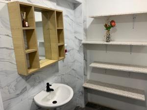 a bathroom with a white sink and a mirror at Casa Samor La Candelaria in Bogotá +92 photos
