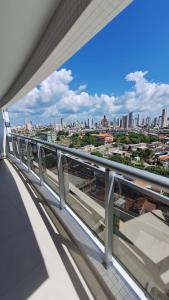 a view of a city from the balcony of a building at Conforto e praticidade em região central de Belém in Belém