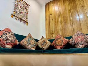 a bunch of pillows sitting on a couch at Araw Boutique in General Luna