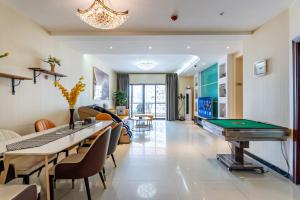 a living room with a pool table and ping pong ball at Jinxin Nanguo in Chongqing