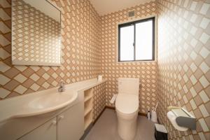 a bathroom with a toilet and a sink and a window at アリュール別府 in Beppu +23 photos