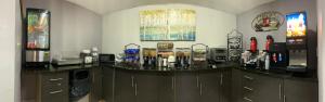 a counter in a room with a coffee shop at Microtel Inn & Suites by Wyndham Tuscaloosa East in Cottondale