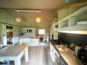 a kitchen with a sink and a counter top at Luxuszelt im Serengeti Park in Hodenhagen