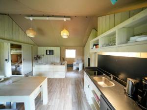 a kitchen with a sink and a counter top at Luxuszelt im Serengeti Park in Hodenhagen