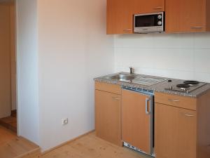 a kitchen with a sink and a microwave at Ferienwohnung in Wildemann in Wildemann