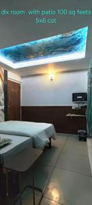 a room with a bed and a ceiling with a window at Greenview holiday inn in Munnar