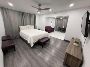 a bedroom with a bed and a living room at Cozy Guest House in amazing Las Vegas in Las Vegas