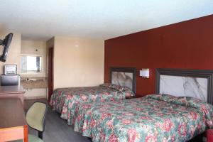 Postel nebo postele na pokoji v ubytování Oak Ridge Inn