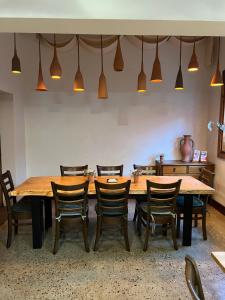 a dining room with a wooden table and chairs at Royal Hotel Coonabarabran in Coonabarabran