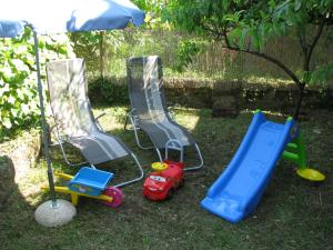 a group of childrens toys sitting in the grass at Apartment Sea Garden in Ičići