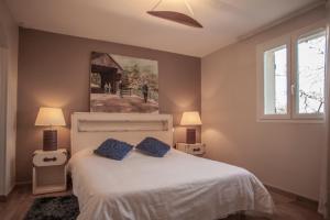 Postel nebo postele na pokoji v ubytování Les chambres du Restaurant le Castellaras - Teritoria