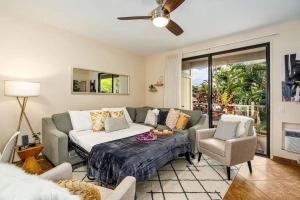 a living room with a couch and a table at Premier Collection at Grand Champions Wailea - Limited-Time Half Off in Wailea