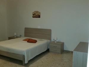 Ένα ή περισσότερα κρεβάτια σε δωμάτιο στο Senza Pensieri