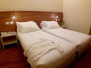 Voodi või voodid majutusasutuse Hotel Forum toas