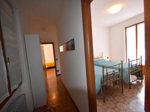 a bedroom with a bed and a table and chairs at Spacious Retreat in Cannero in Cannero Riviera +34 photos