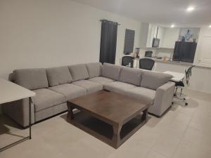 a living room with a couch and a coffee table at Brand New Home and Furniture in Dallas