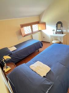 Postel nebo postele na pokoji v ubytování Villa Milone Etna Country House